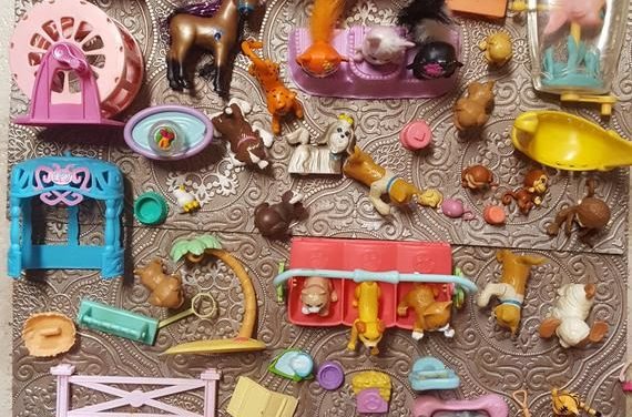 Vintage Hasbro Littlest Pet Shop animals along with their cages, pools, habitats, accessories, bowls, treats, and (of course) toys